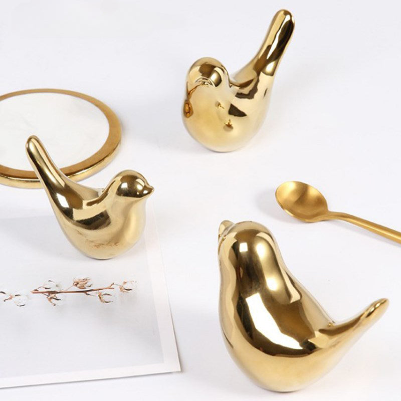 Ceramic bird figurines on shelf