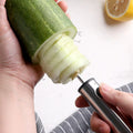 Stainless steel kitchen corer tool coring a cucumber