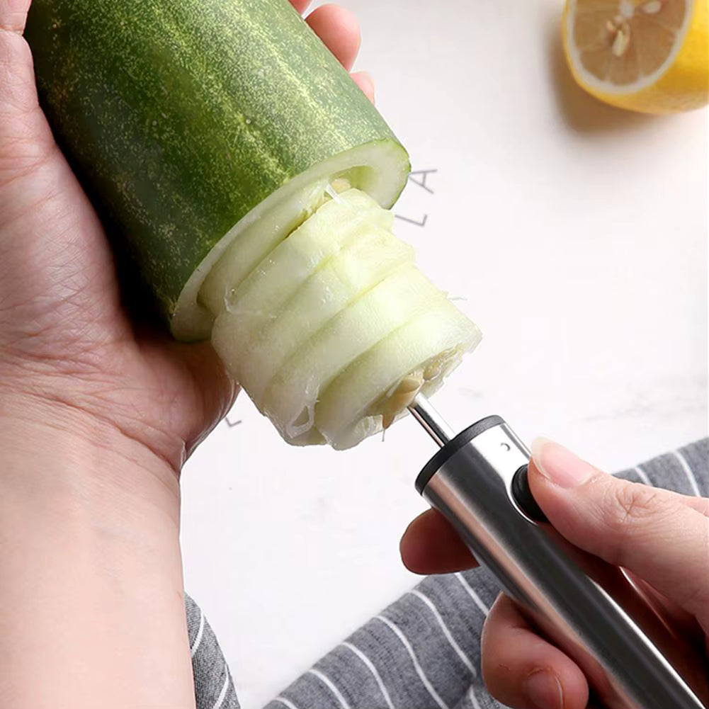 Stainless steel kitchen corer tool coring a cucumber